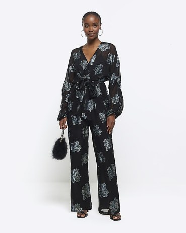 RIVER ISLAND Black Glitter Floral Belted Jumpsuit ~ glittering sheer sleeve tie waist jumpsuits ~ women’s all in one party fashion