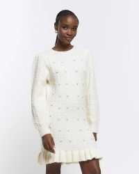 River Island Cream Cable Knit Jumper Mini Dress | women’s knitted long sleeve ruffle hem dresses | embellished knitwear fashion