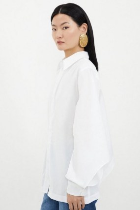 KAREN MILLEN Tailored Cutout Sleeve Detail Asymmetric Shirt in White / women’s chic contemporary shirts / womens cut out detail clothing - flipped