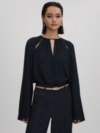 REISS GRACIE CUT-OUT FLUTE SLEEVE BLOUSE in NAVY – dark blue cutout blouses with flared sleeves