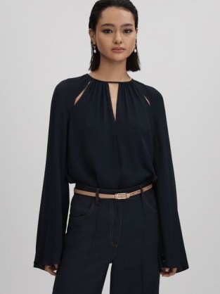 REISS GRACIE CUT-OUT FLUTE SLEEVE BLOUSE in NAVY – dark blue cutout blouses with flared sleeves
