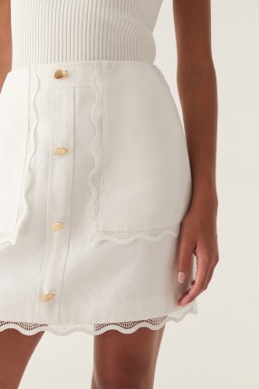 Aje. Reva Wave Trim Skirt in Ivory – luxe off white scallop trimmed mini skirts