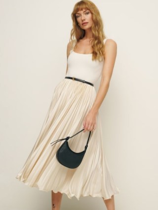 Reformation Bala Satin Skirt in Ivory – silky pleated midi skirts – luxe fashion - flipped