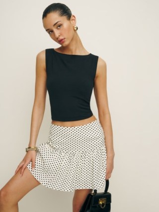 Reformation Mabel Skirt in Eclipse Dot / white pleated spot print mini skirts / polka dot fashion - flipped