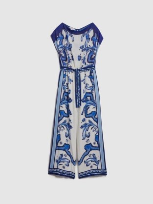Reiss DIANA TILE PRINT OFF-THE-SHOULDER JUMPSUIT in BLUE – printed asymmetric neckline jumpsuits - flipped