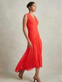 Reiss SAFFY RUCHED BODYCON MIDI DRESS in CORAL – bright asymmetric occasion dresses – vibrant evening event clothing