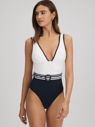 REISS WILLOW COLOURBLOCK BELTED SWIMSUIT in WHITE/NAVY / white and navy blue colour block high leg swumsuits / deep plunge front swimwear